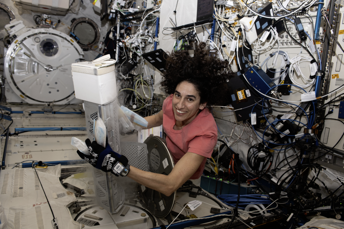 Astronaut Jasmin Moghbeli works with Chunhui Xu's experiment aboard ISS