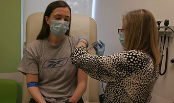 Person receiving a vaccine shot