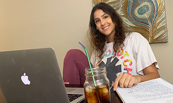 Sofia Garcia-Arias sits in front of a laptop