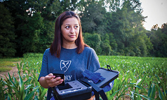 Roxana Chicas poses in a corn field in Oxford, Georgia