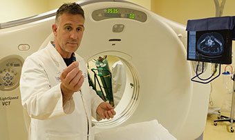 Emory interventional radiologist David Prologo shows a tool he uses