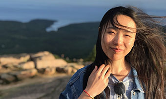 Xinyi Huang poses on a vacation