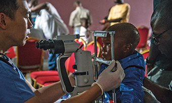 World Health Organization photo of a child receiving eye care