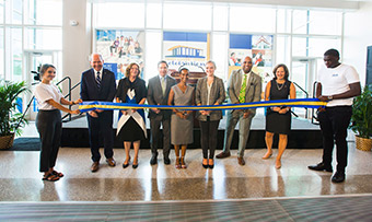 Emory leaders cut a ribbon to open the new Emory Student Centers