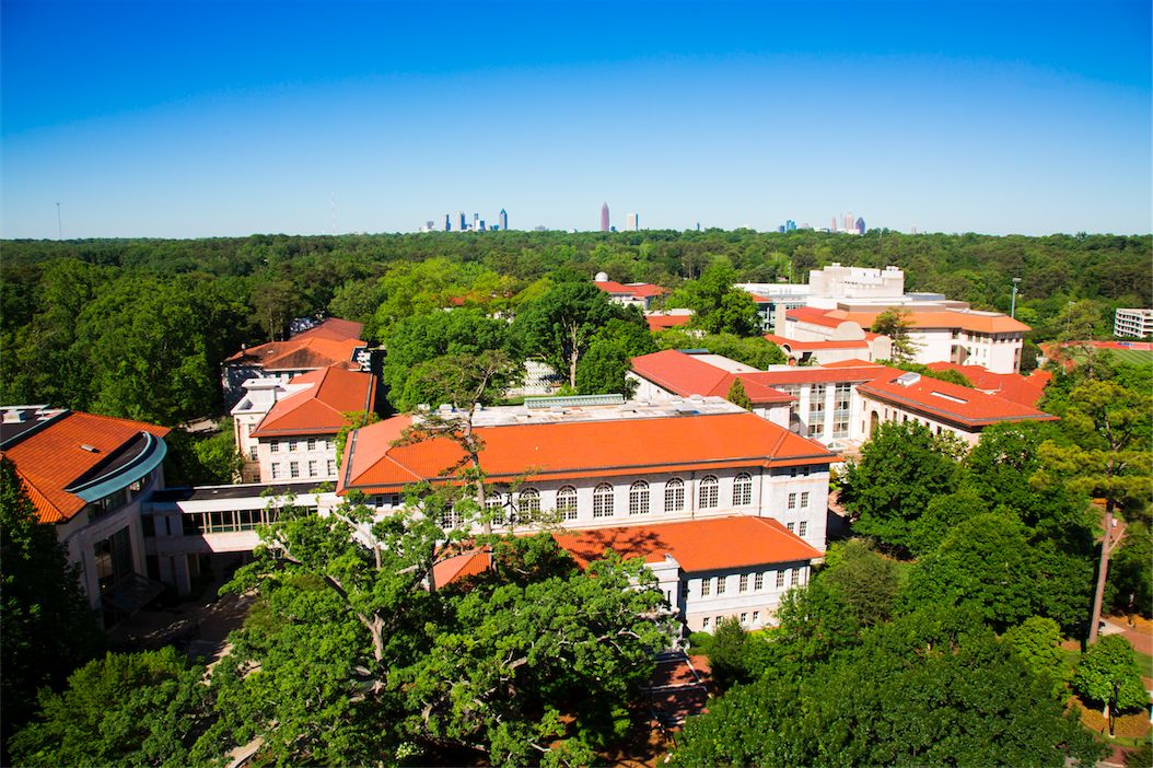 wide view of Emory campus buildings with Atlanta skyline in the distance